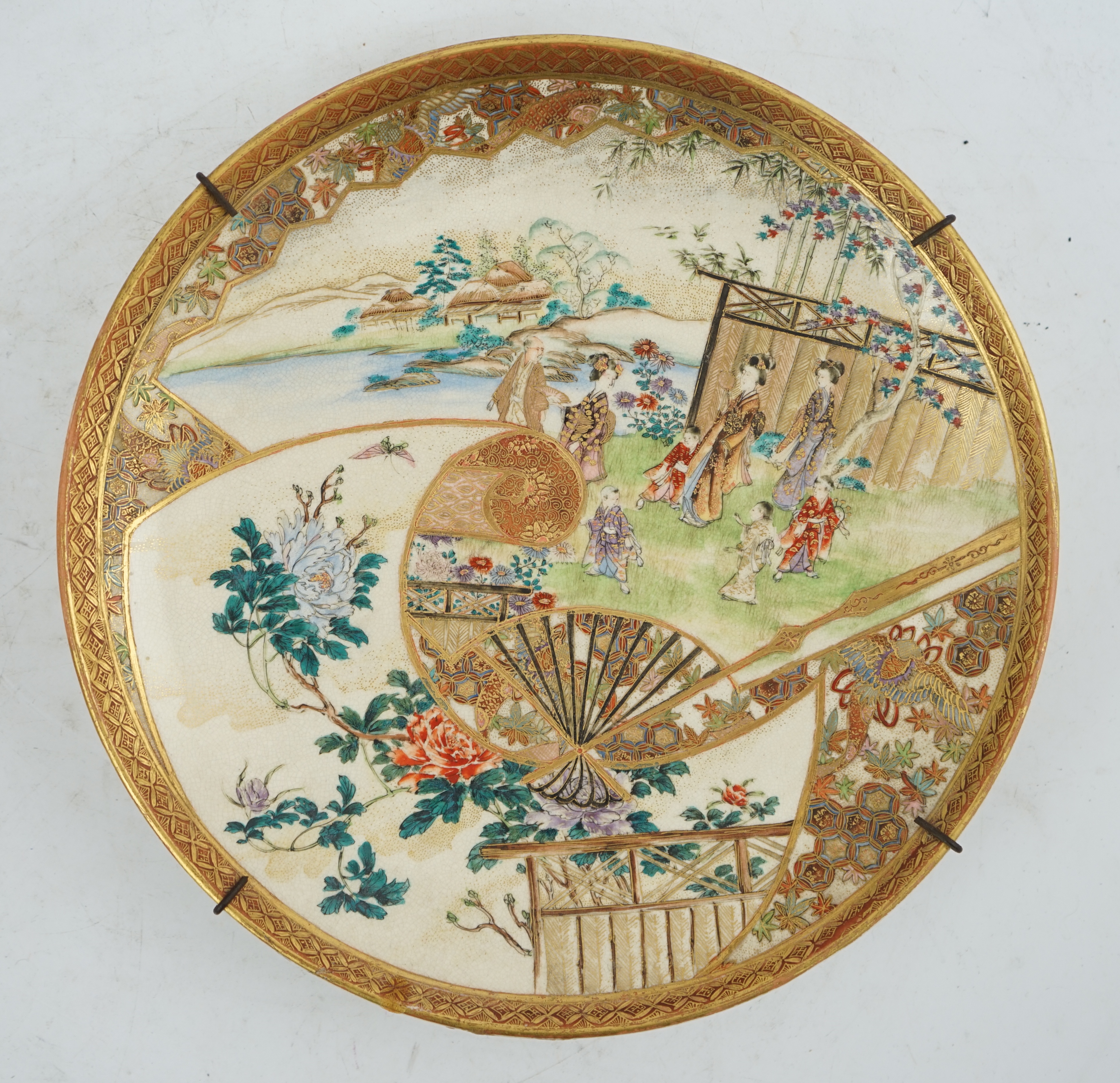 A Japanese Satsuma ‘garden scene’ dish, Meiji period